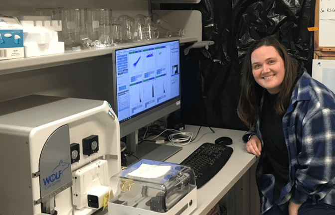 Ph.D. student Beth Connors sorting cells with the WOLF Cell Sorter at Palmer Station, Antarctica.